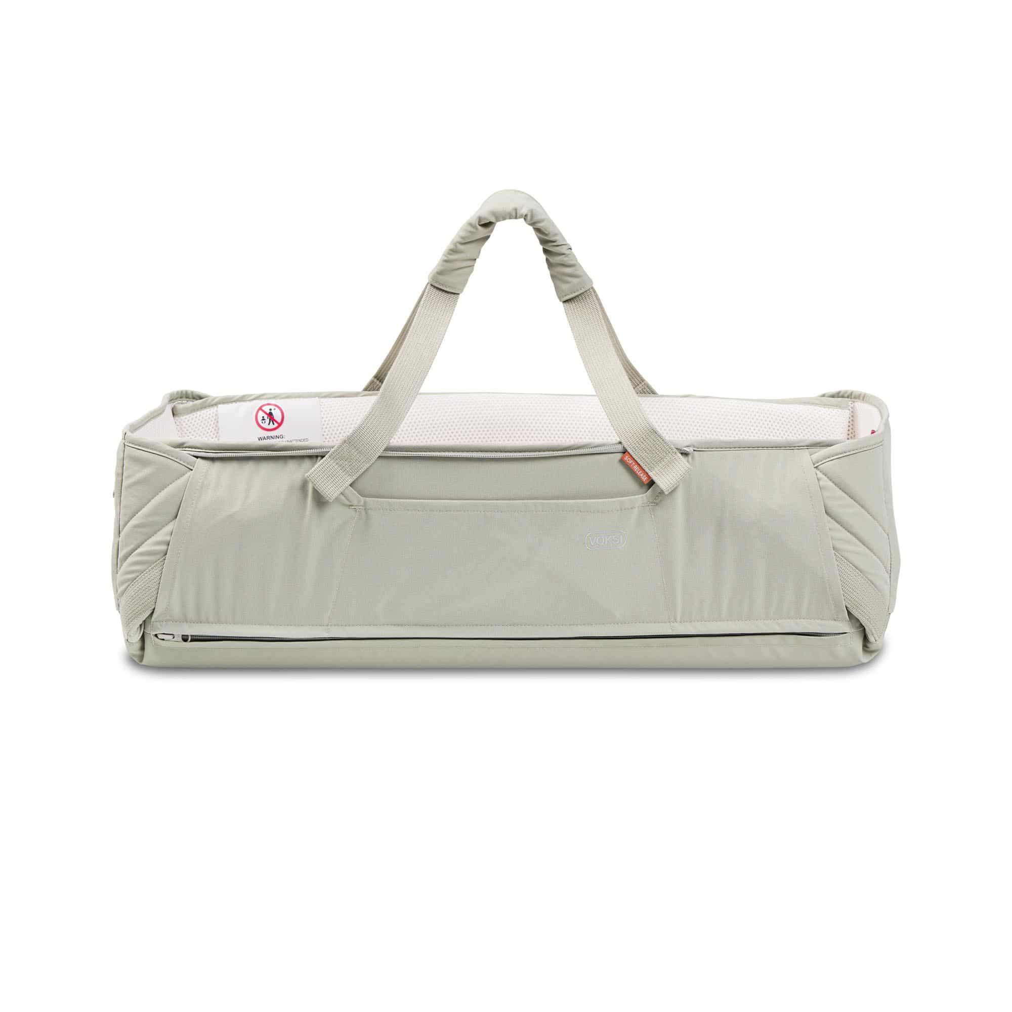 Voksi Carry Me Misty Green Cream vue de face avec anses de transport