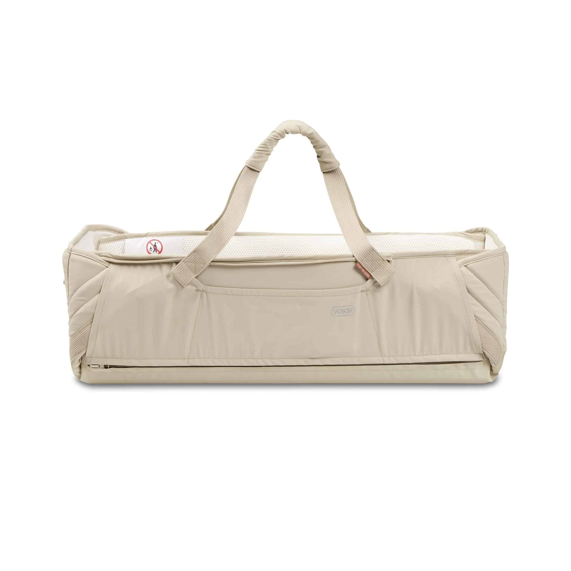 Voksi Carry Me Seashellsand Cream vue de face avec anses de transport